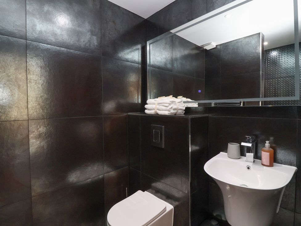 A bathroom with a sink and towels at Ninky Nonk in Bristol
