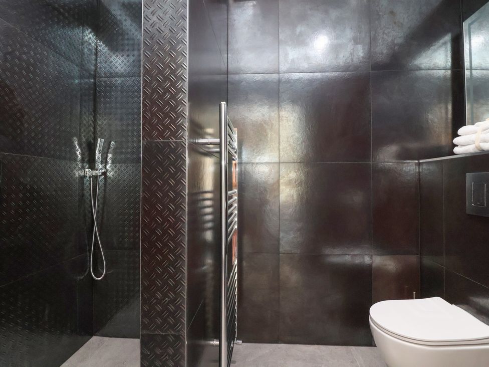 A bathroom with a shower and toilet at Ninky Nonk Bristol