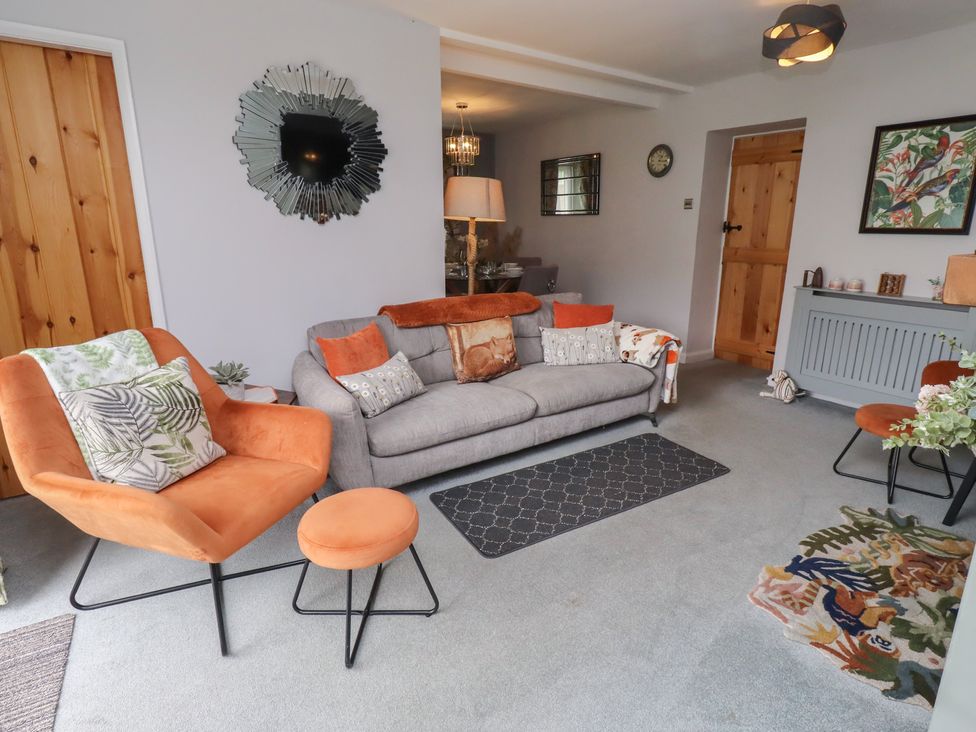 A living room with a sofa and armchairs at Country Retreat in Ponteland