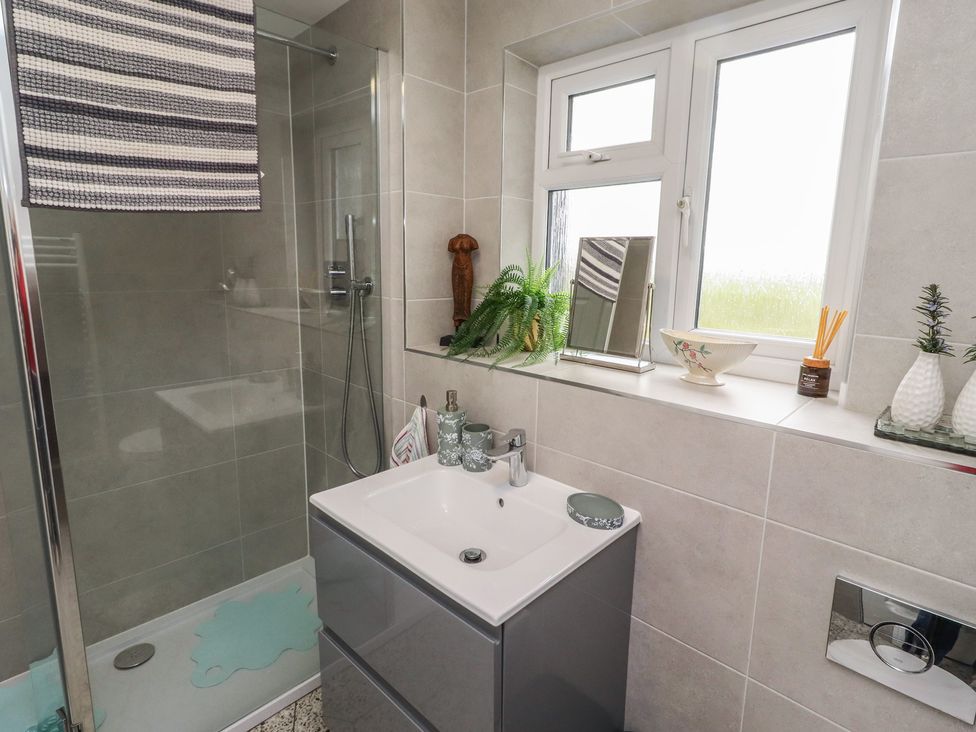 A bathroom with a shower and sink at Country Retreat in Ponteland