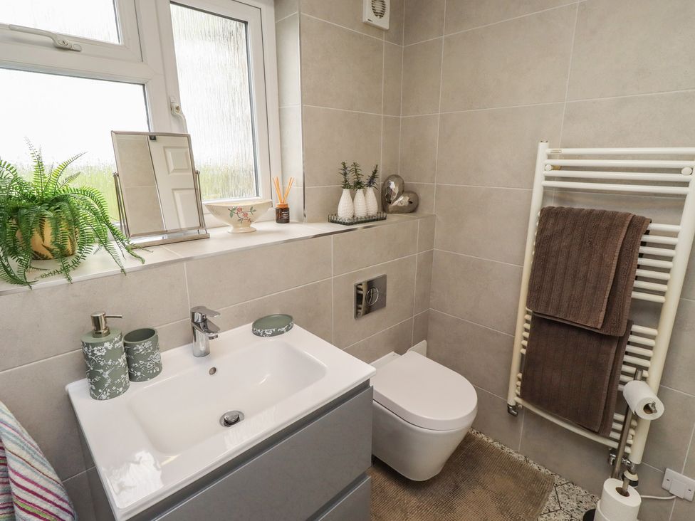 A bathroom with a vanity and toilet at Country Retreat in Ponteland