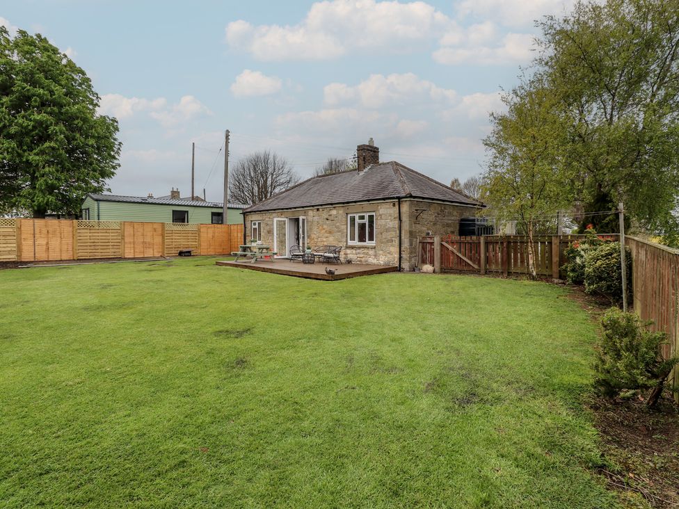 A house with a garden and deck at Country Retreat in Ponteland