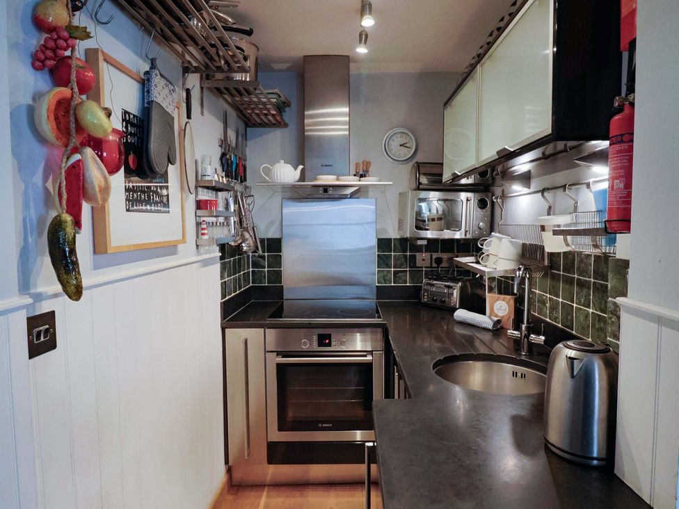 A kitchen with various appliances and fixtures at Seaside, Lyme Regis