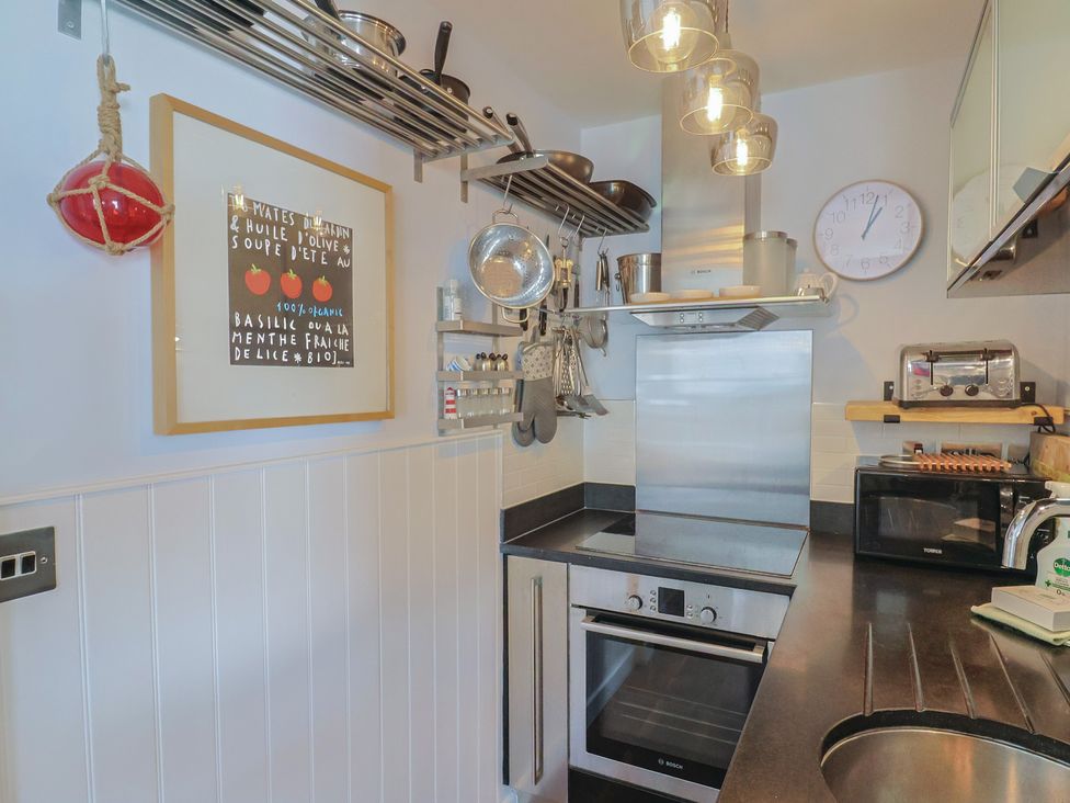 A kitchen with various appliances and utensils at Seaside in Lyme Regis