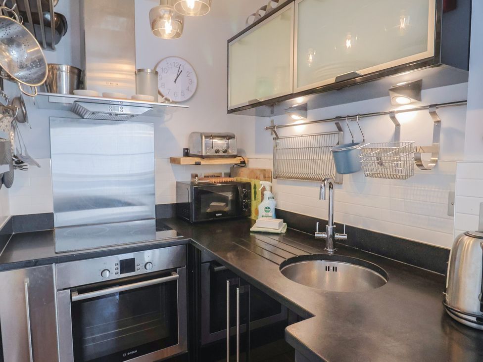 A kitchen with appliances and utensils at Seaside in Lyme Regis