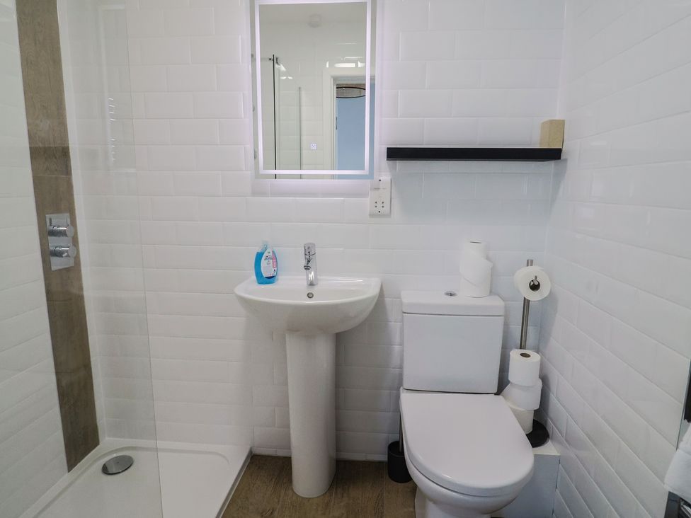 A bathroom with a sink and toilet at Seaside in Lyme Regis