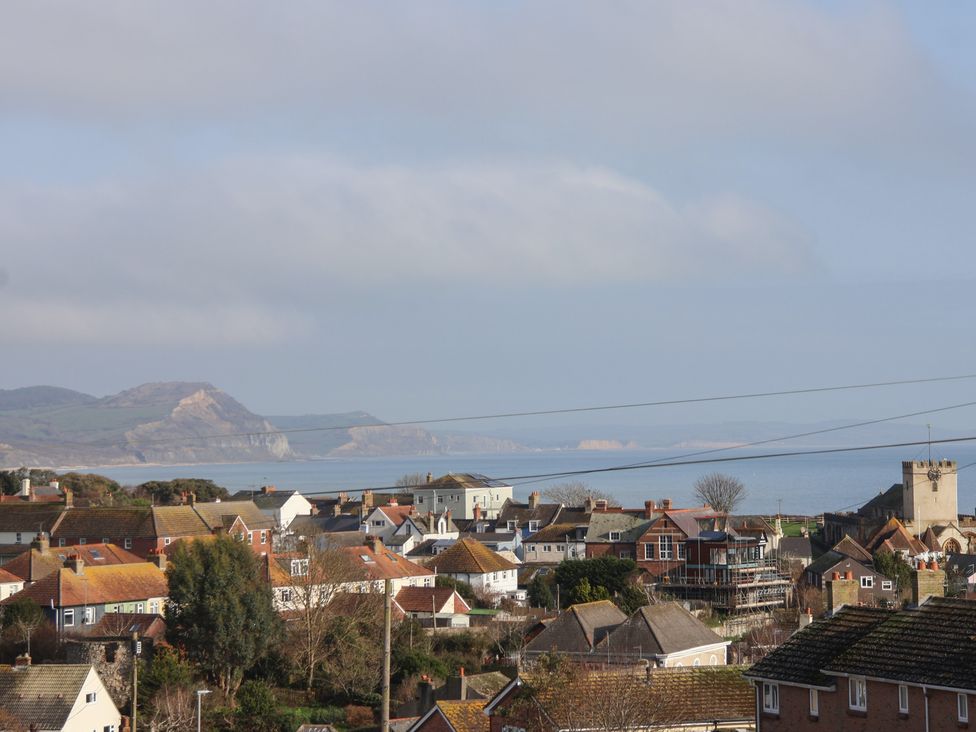 A view of houses and the sea at Greystones Flat in Lyme Regis