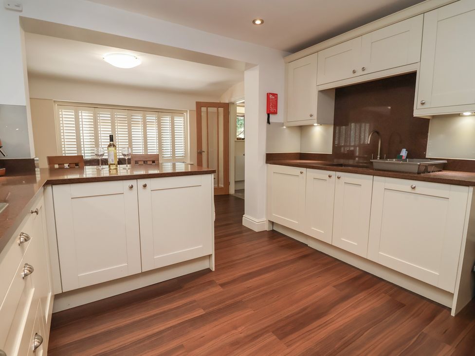A kitchen with countertop and sink at 4 Green Farm Cottage in Saughall