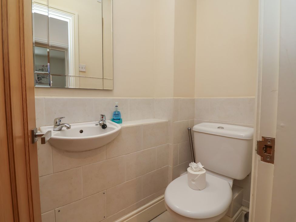 A bathroom with toilet and sink at 4 Green Farm Cottage in Saughall