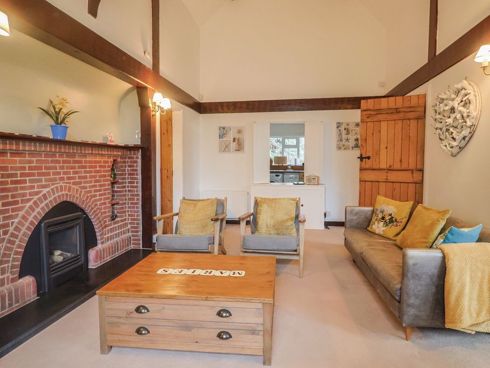 A living room with a sofa and armchairs at Maries Lyme Regis