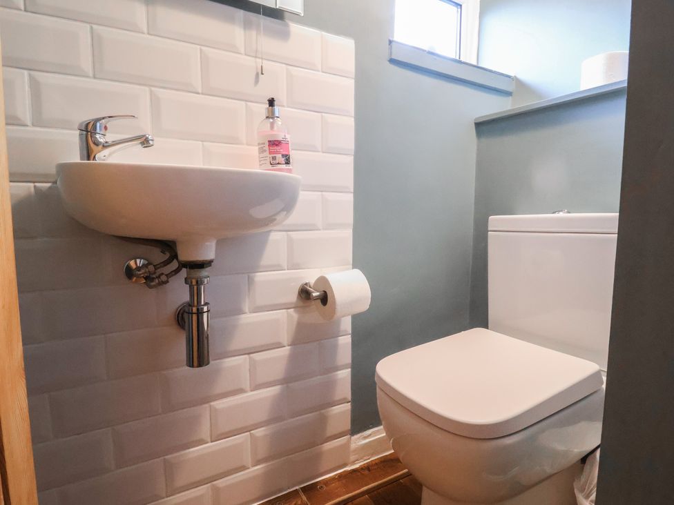 A bathroom with a sink and a toilet at Maries in Lyme Regis