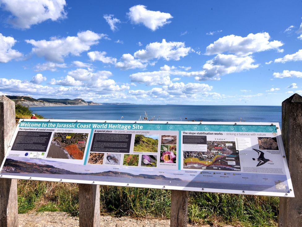 A sign at the Jurassic Coast World Heritage Site near the ocean in Lyme Regis