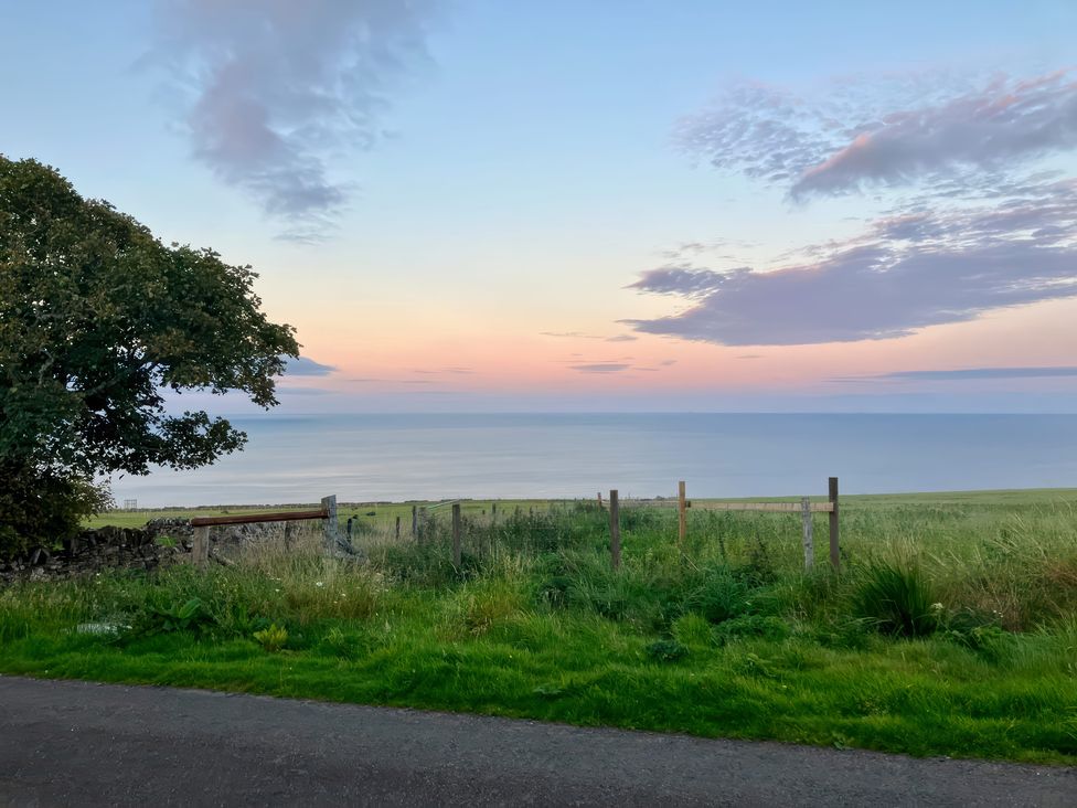 A view of the sea from a grassy area at Ceol-na-Mara Newport near Dunbeath