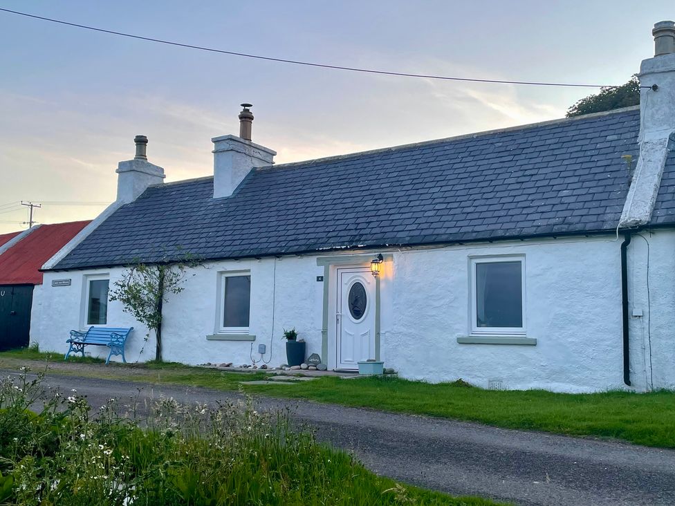 A house with a front door and windows at Ceol-na-Mara Newport near Dunbeath