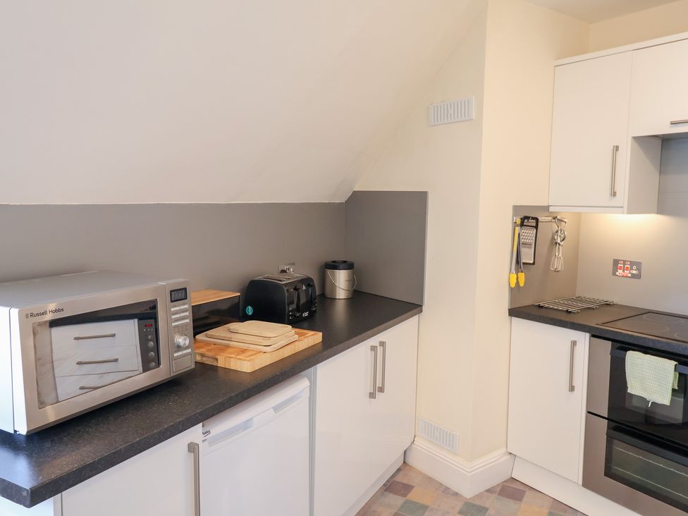 A kitchen with appliances and countertop at Watersmeet Lyme Regis