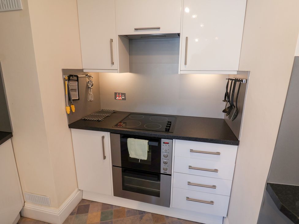 A kitchen with an oven and stove at Watersmeet, Lyme Regis