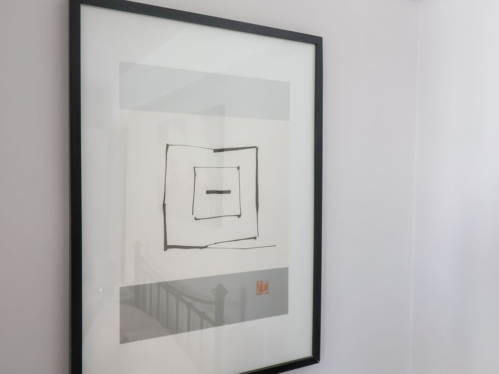 A framed artwork on a wall at Watersmeet in Lyme Regis