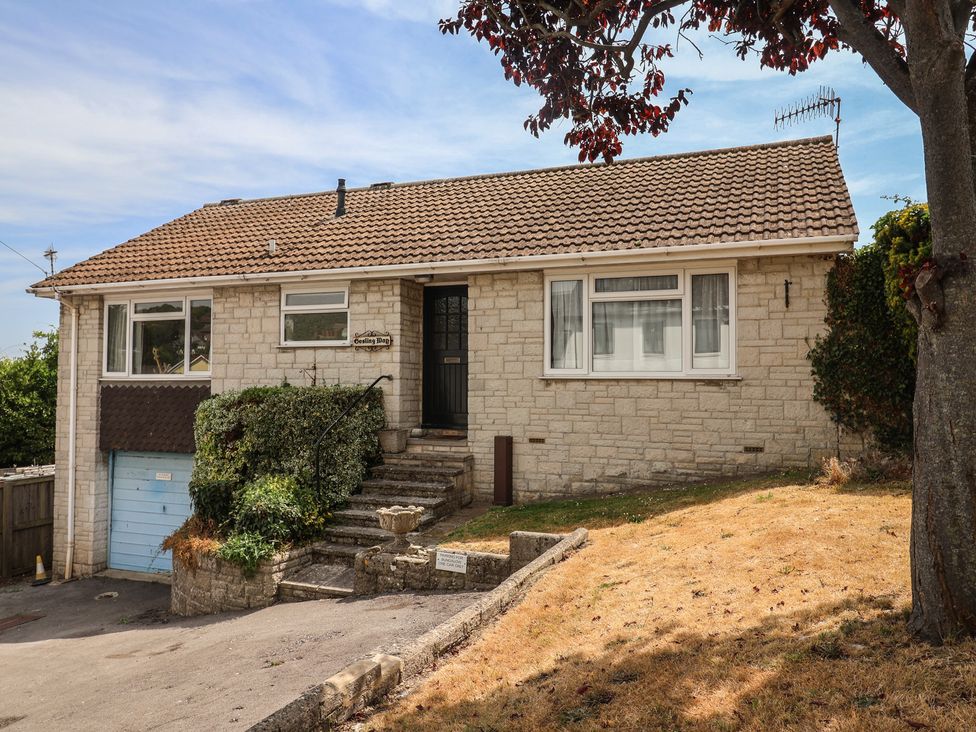 A house with a garden and driveway at Gosling Way Lyme Regis