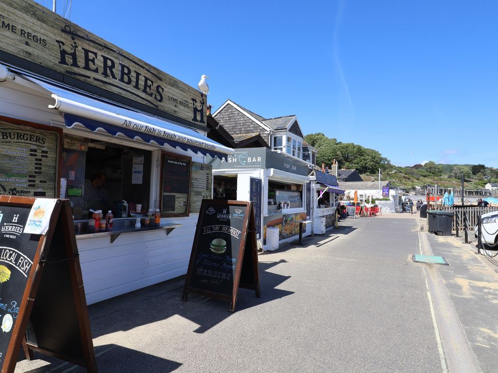 A row of food stalls along the beach at Gosling Way Lyme Regis