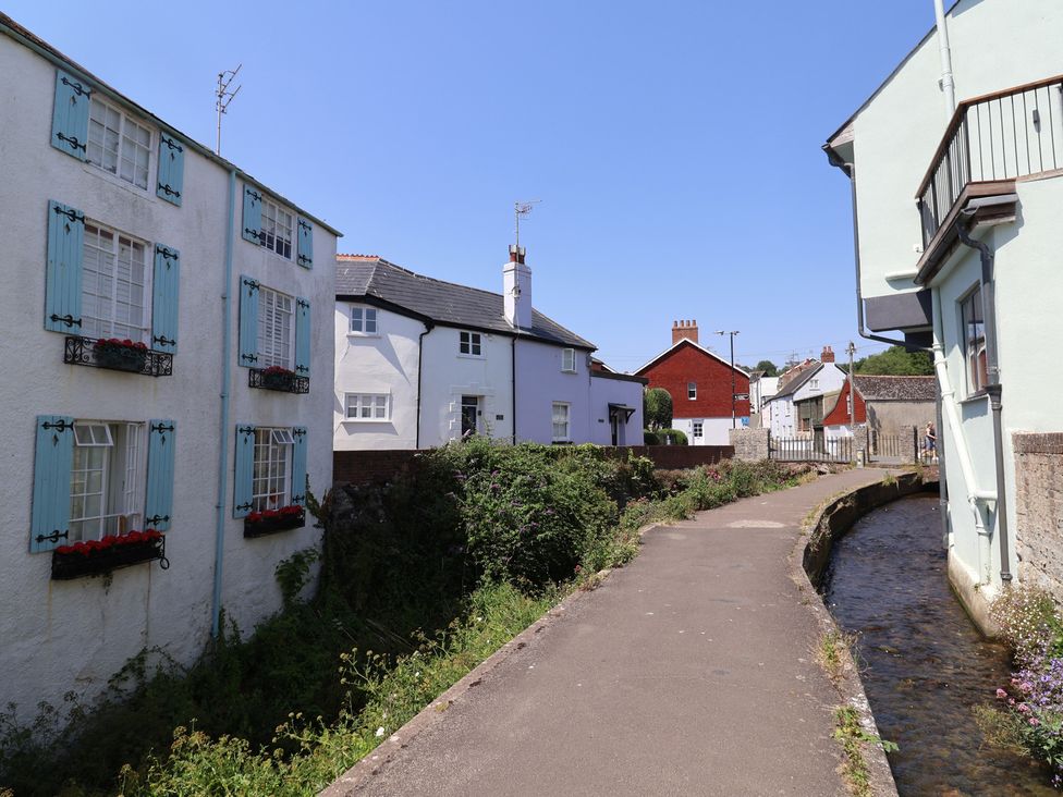 An outdoor area with houses and a stream at Gosling Way in Lyme Regis