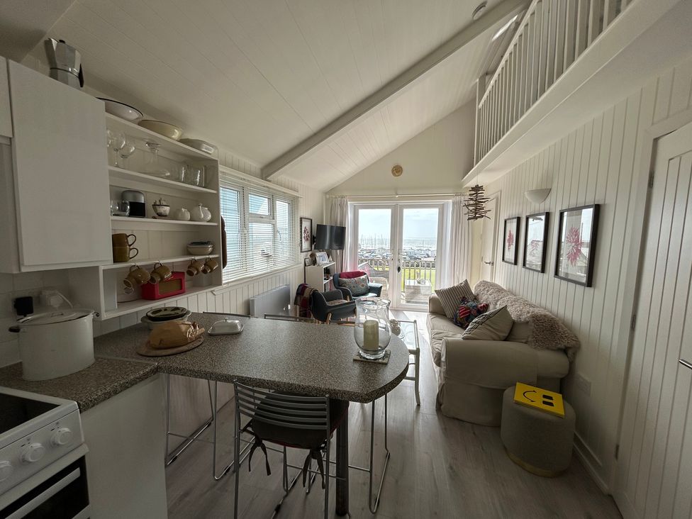 A living room with a couch and chairs at 8 Bowling Green Chalets Lyme Regis