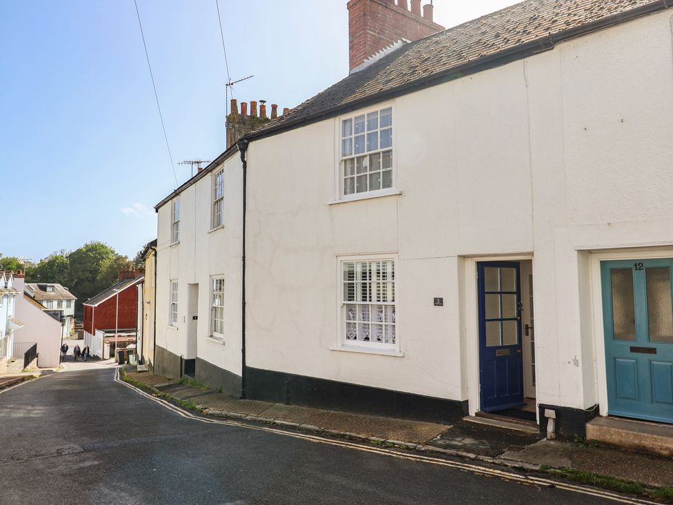 A house exterior with a blue front door at 3 Dolphin Cottages in Lyme Regis