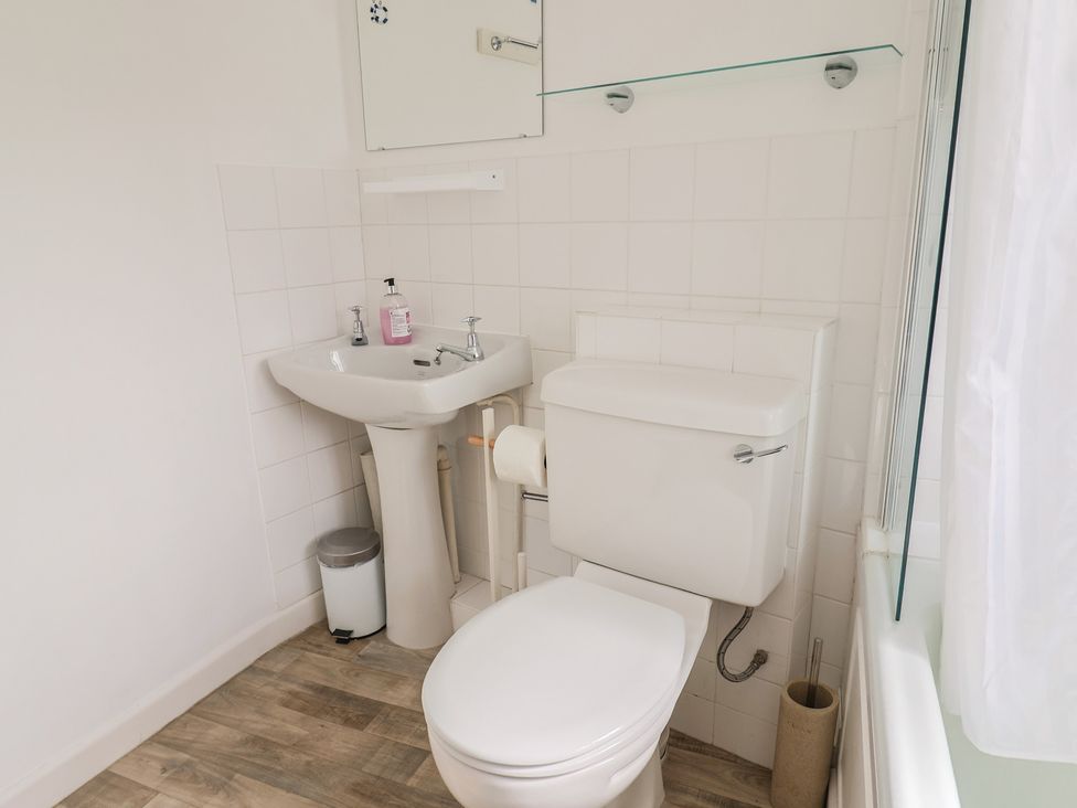 A bathroom with sink and toilet at 3 Dolphin Cottages in Lyme Regis