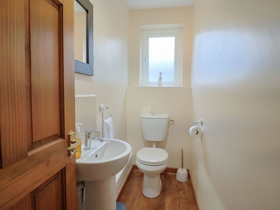 A bathroom with a sink and toilet at The Orchard Country House Rousdon