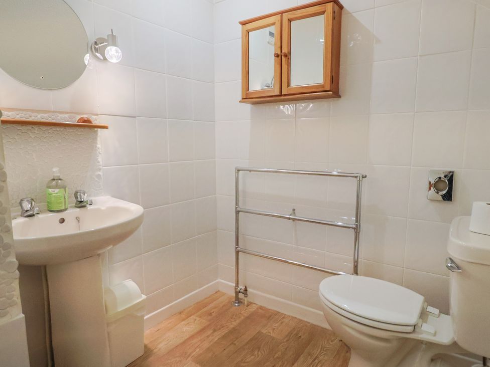 A bathroom with a sink and toilet at The Orchard Country House Rousdon