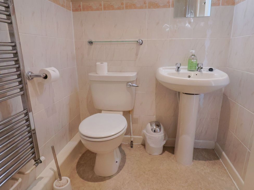A bathroom with toilet and sink at The Orchard Country House Rousdon