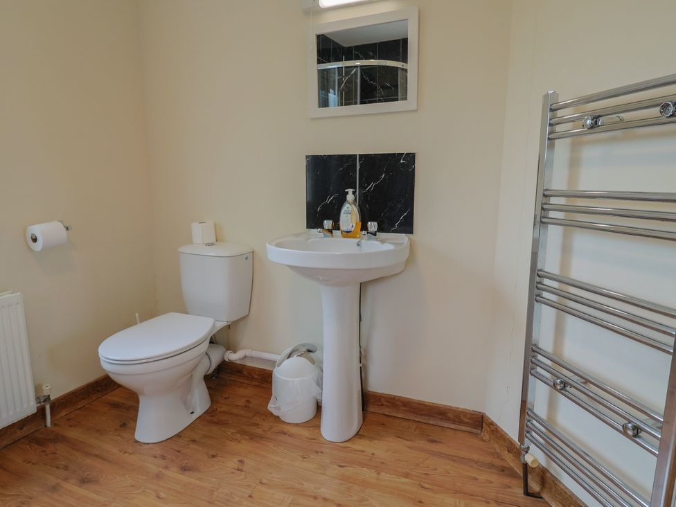 A bathroom featuring a sink and toilet at The Orchard Country House in Rousdon