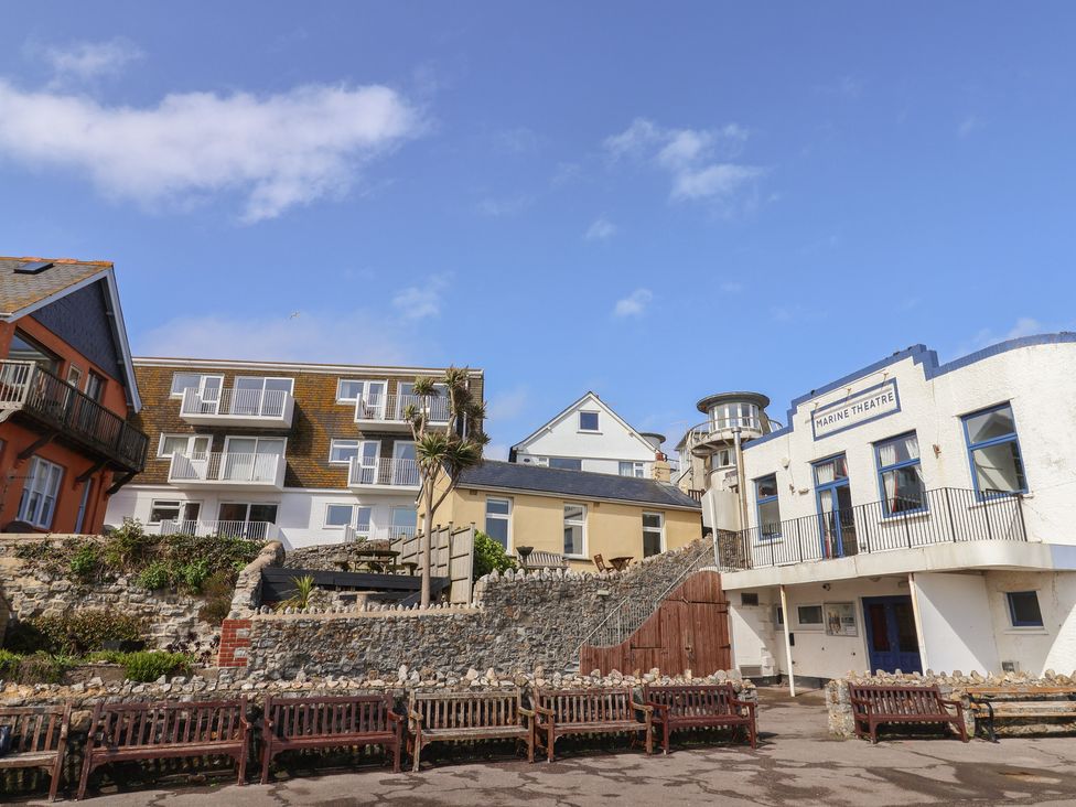 An outdoor area featuring buildings and benches at 1 Bay View Court Lyme Regis