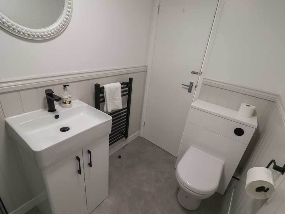 A bathroom with a sink and a toilet at 1 Bay View Court in Lyme Regis