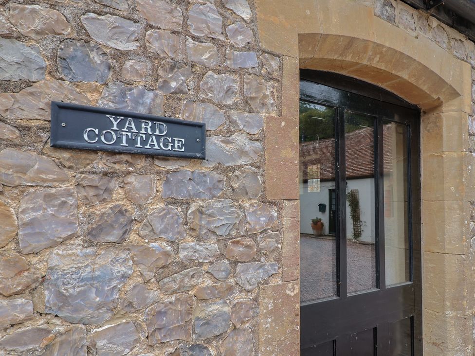 An entryway with a sign reading Yard Cottage at Yard Cottage in Rousdon