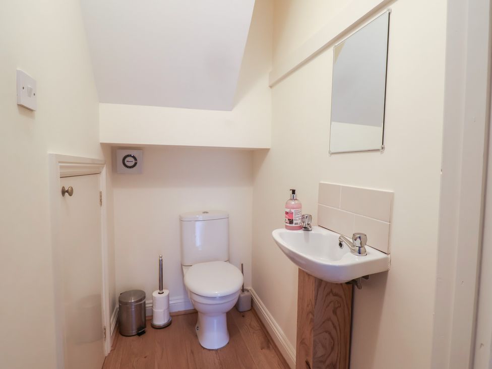 A bathroom with toilet and sink at Greystones in Lyme Regis