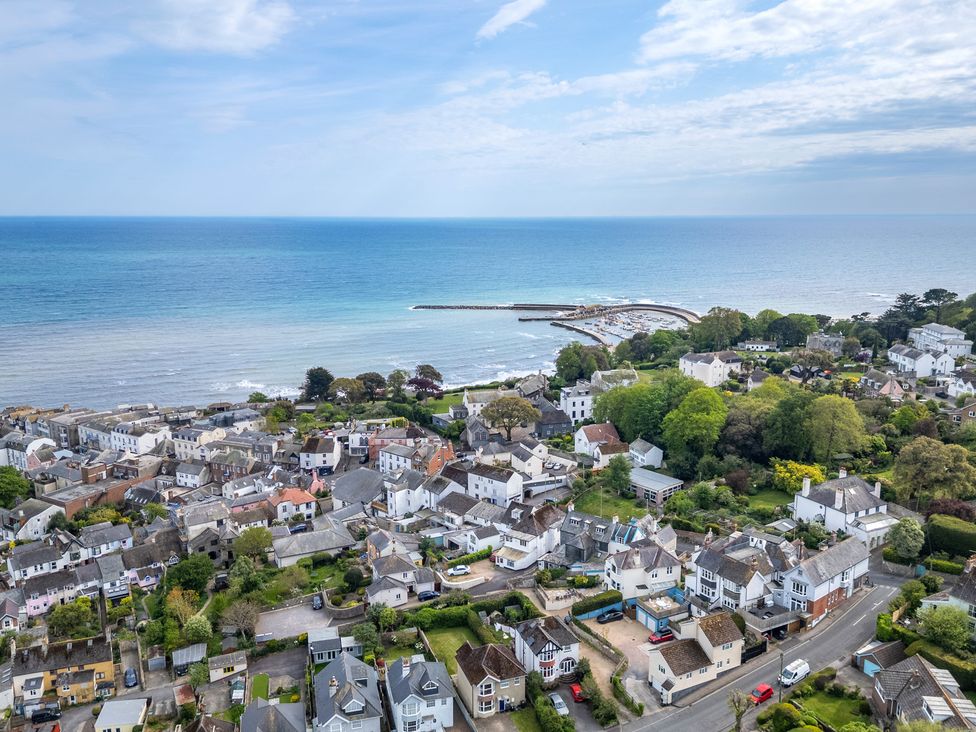A coastal view with houses and ocean at 2 Hadleigh Villas Lyme Regis