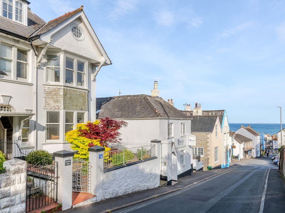 A street view with houses and a garden at 2 Hadleigh Villas in Lyme Regis