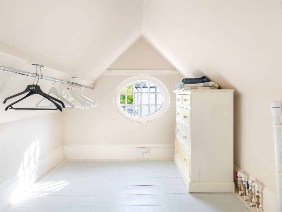 A dressing room with hangers and a dresser at 2 Hadleigh Villas Lyme Regis