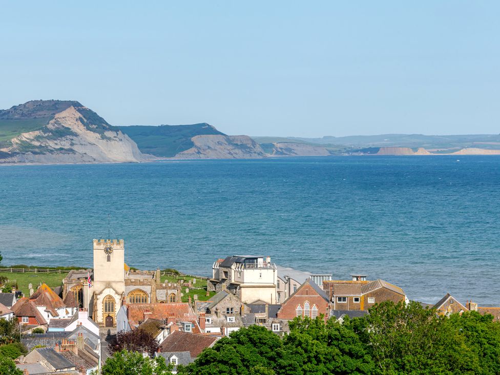 A view of coastal buildings and sea at 2 Hadleigh Villas Lyme Regis