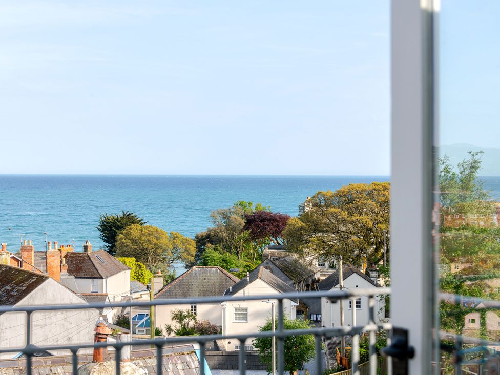 A view of the sea and houses from a balcony at 2 Hadleigh Villas Lyme Regis