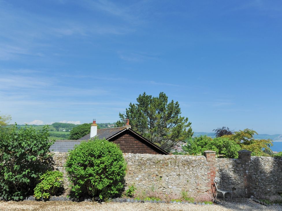 A view of a house and garden at Penny Plot Cottage in Lyme Regis