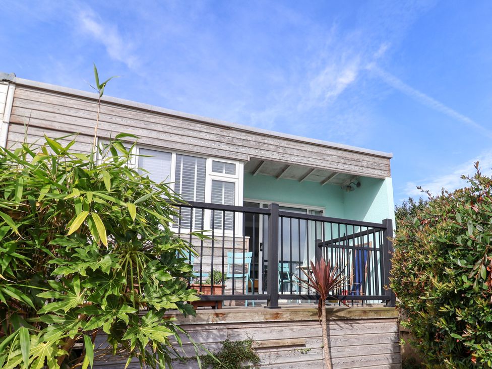 A house with a deck and railings at 1 Wellhayes Lyme Regis