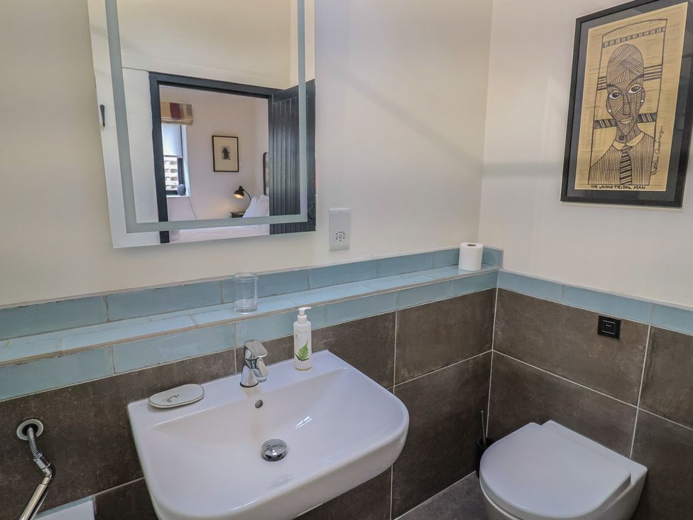 A bathroom with a sink and toilet at The Dairy in Bridport