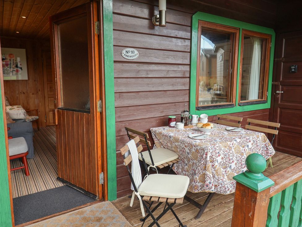 An outdoor patio with a table set for breakfast at 10 Pinewood Retreat in Pinewood