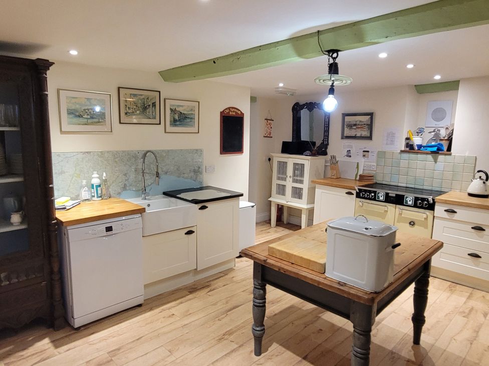 A kitchen with a sink and stove at Old Monmouth in Lyme Regis