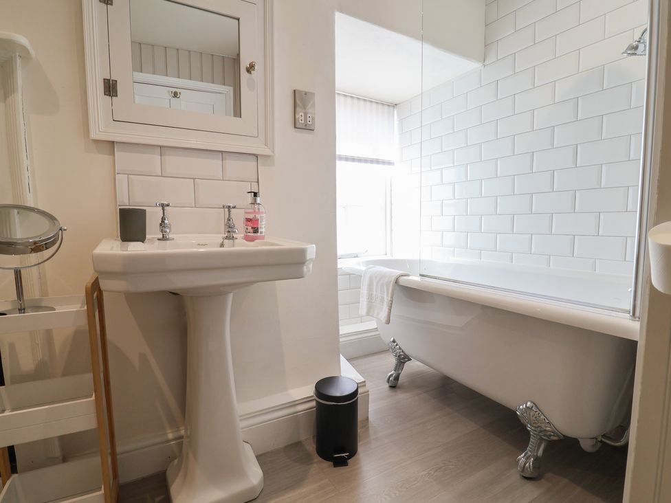 A bathroom with a sink and bathtub at The Little Rose in Lyme Regis