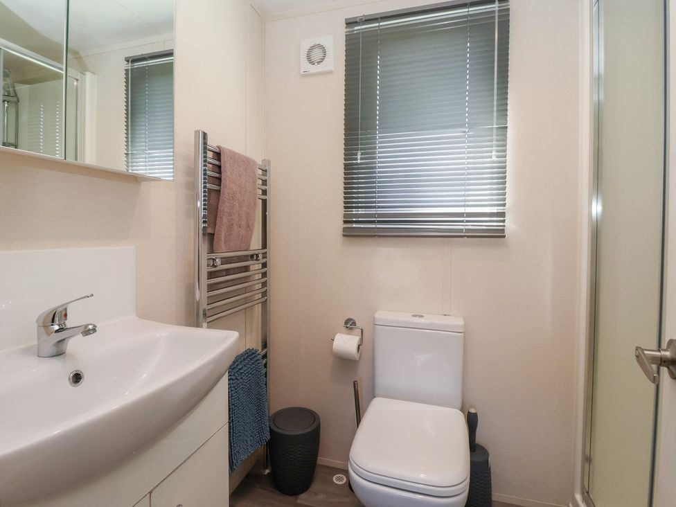 A bathroom with a sink and toilet at Away Daze in Carnaby near Bridlington