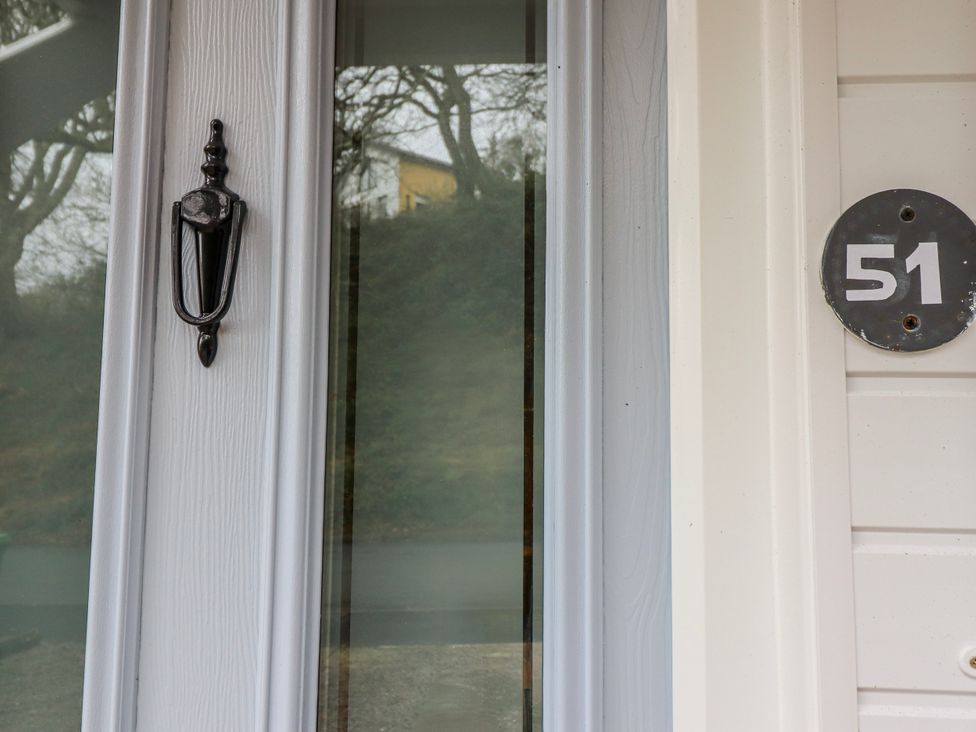 A door with a knocker and house number 51 at Green Cottage in Borth-Y-Gest