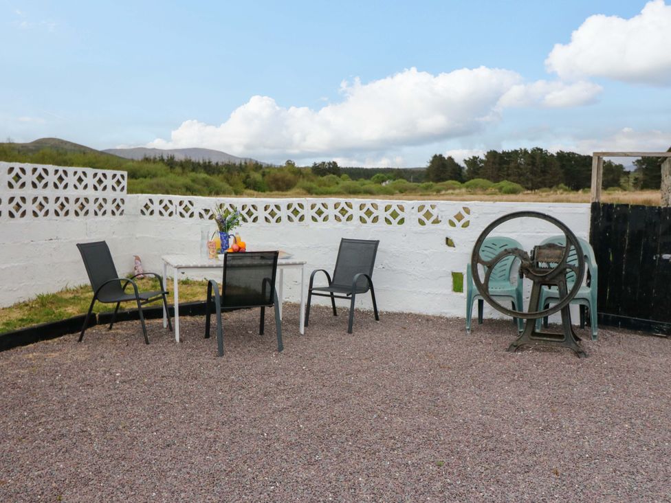 A garden area with a table and chairs at Forest View in Ballinskelligs, County Kerry