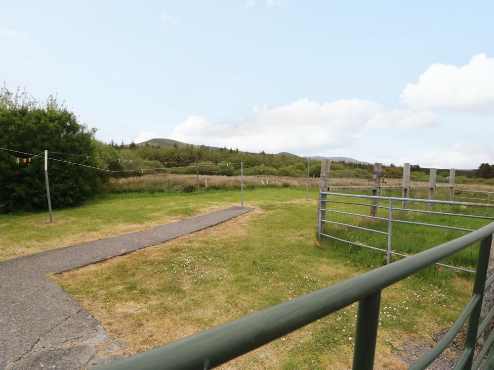 An outdoor area with a pathway and fence at Forest View in Ballinskelligs, County Kerry